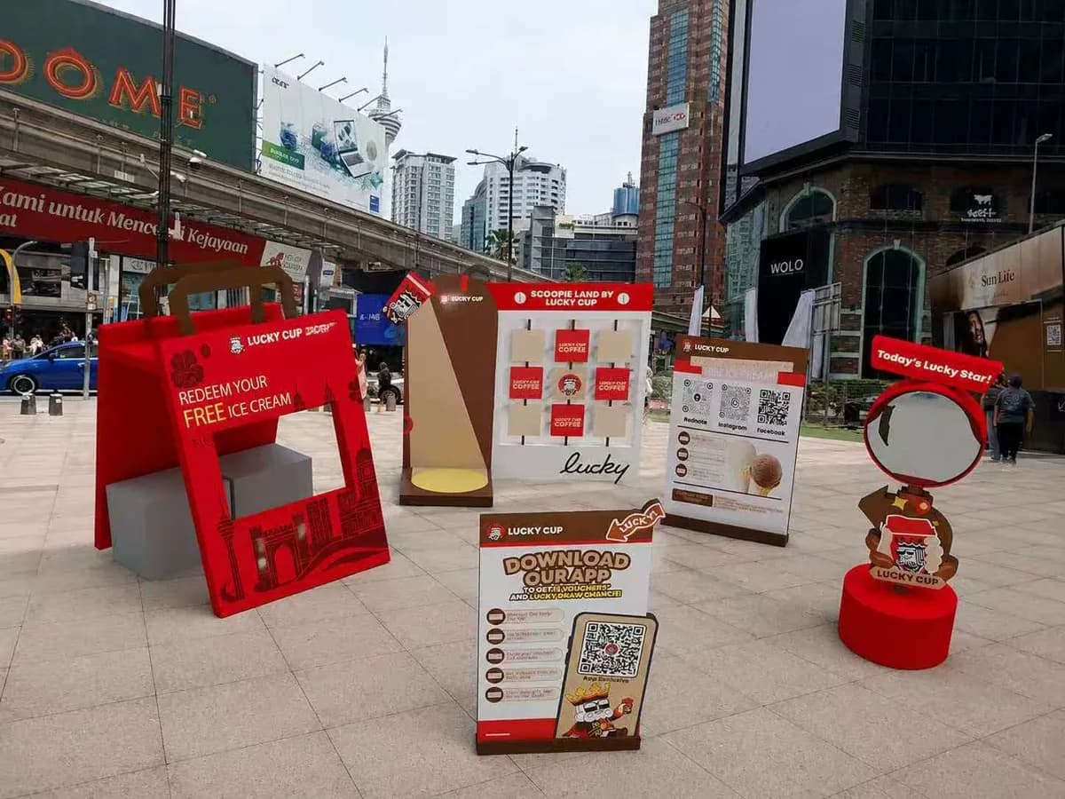 Collection of red Lucky Cup street activation signs and freestanding display elements