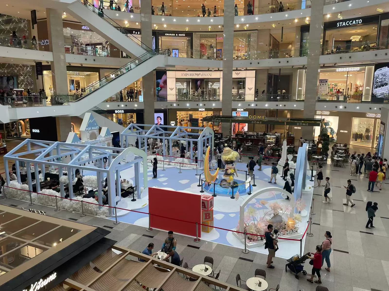 Large public activation environment installed across a multi-level shopping mall atrium